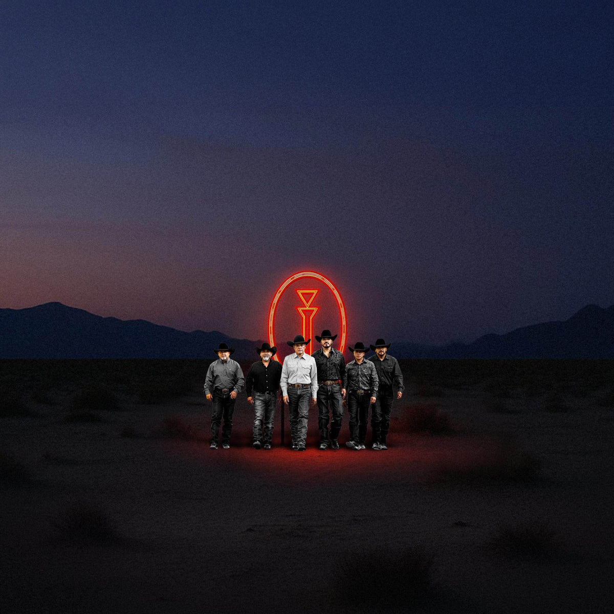 Intocable in front of the neon emblem
