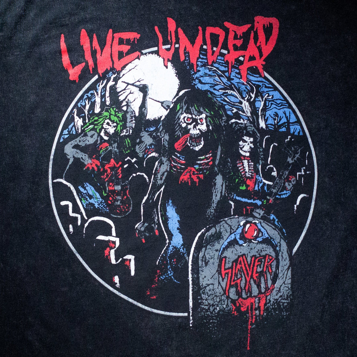 Commemorate the 40th anniversary of Slayer‚Äôs iconic with the Live Undead album with this special Anniversary Edition stonewashed tee. This premium staple stone wash t-shirt has a vintage look and feel to give it a perfectly worn-in feel the moment you put it on.
 
 100% ring-spun cotton fabric
 Stonewashed finished classic
 40th Anniversary Live Undead Collection